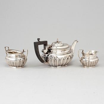 A silver teapot, creamer and sugar bowl, S Glass, Birmingham 1908.