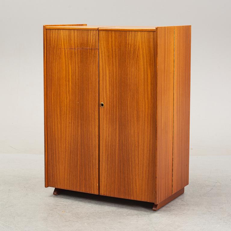 A mahogany veneered convertible cabinet, mid 20th Century.