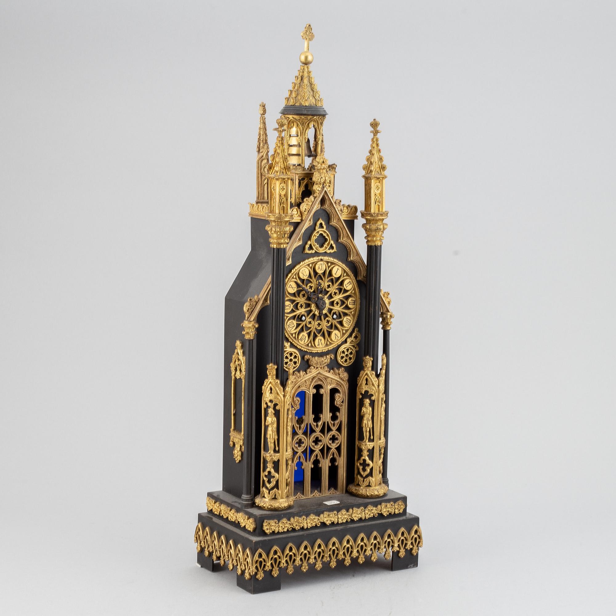 A gothic revival mantel clock.