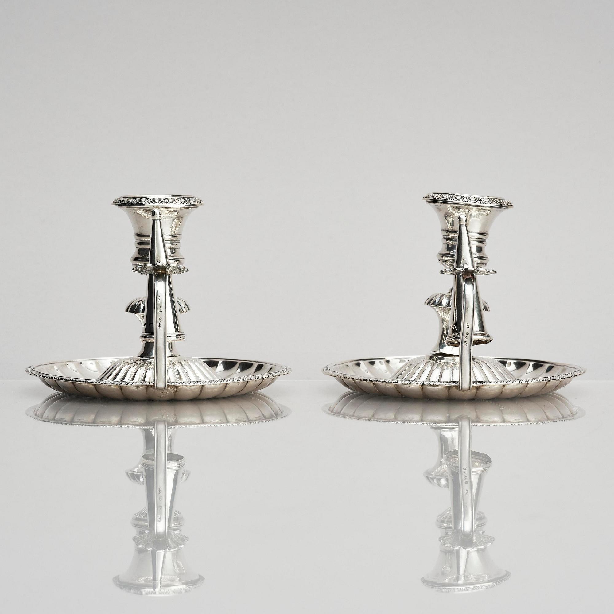 A pair of Swedish 19th century silver chamber-candlesticks, marks of Adolf Zethelius, Stockholm 1831.