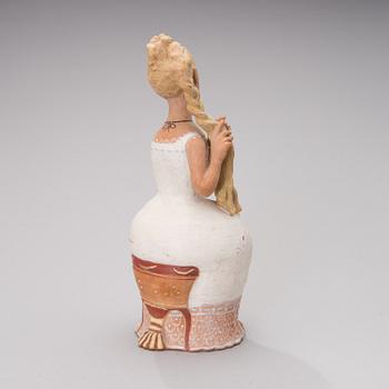 ceramic figurine, signed an d dated 1956.