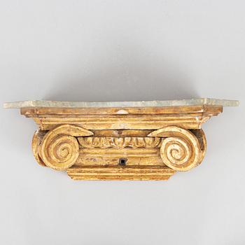 A Louis XVI style sculptured, painted and gilded wall bracket,