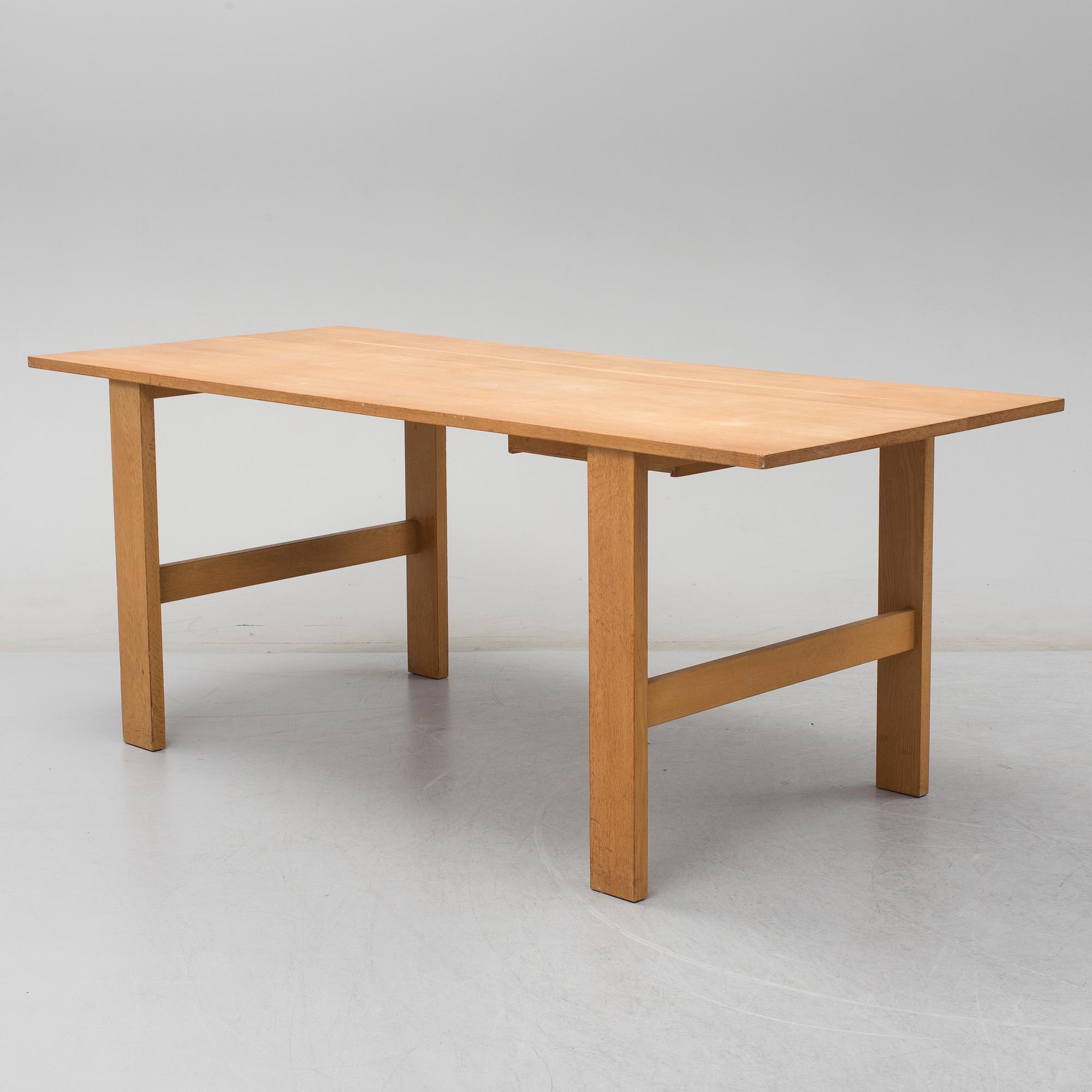A second half of the 20th century oak table, 'Fogar', by John Kandell.
