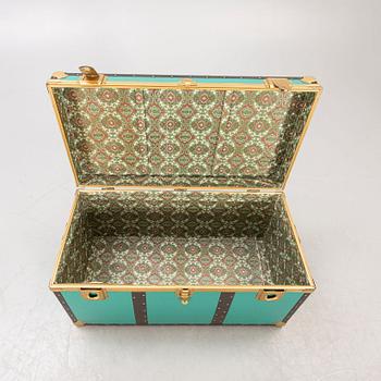 A mid 1900s metal trunk.