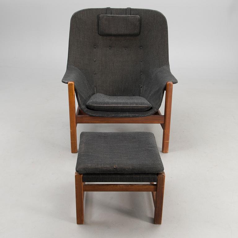 A 1960s 'Caravelle' armchair and ottoman for Puunveisto Oy - Träsnideri Ab, Finland.