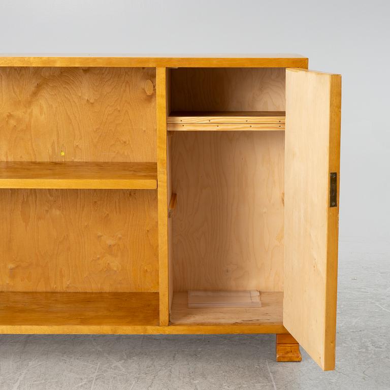 A bookcase with cabinet, 1930's.