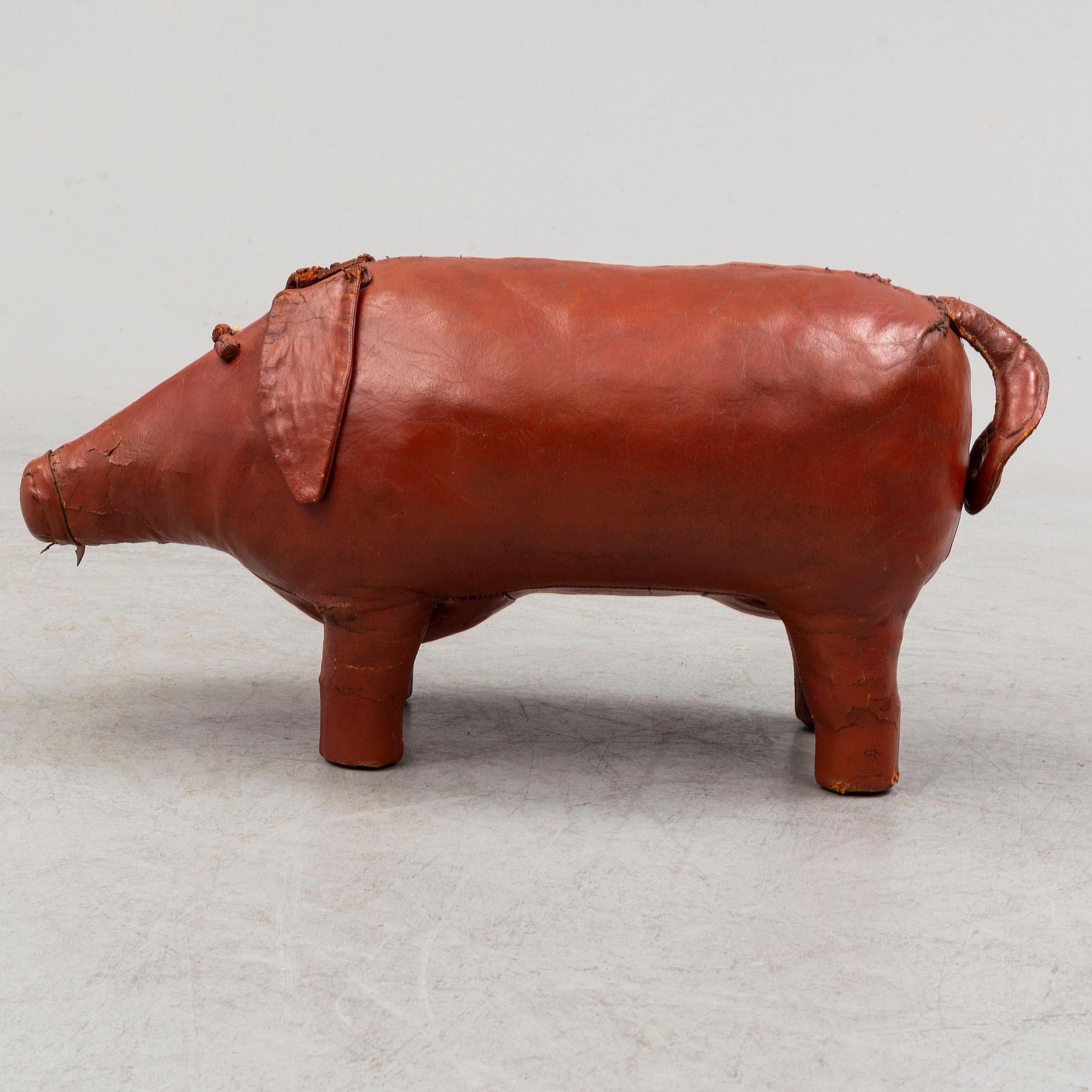 A leather footstool by Dimitri Omersa & Co.