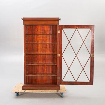 A mahogany Empire mid 19th century book cabinet.