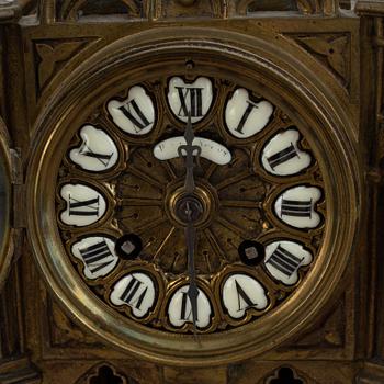 A mantle clock with pair of candelabra, late 19th century.