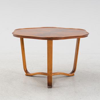 A 1940s mahogany coffee table.