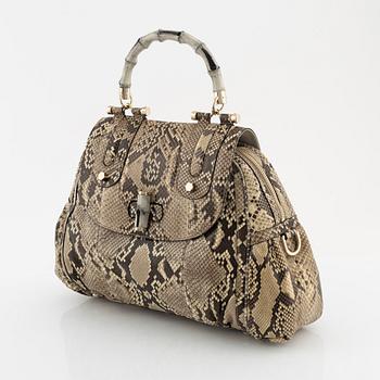 Gucci, a 'Pop Bamboo' python bag.
