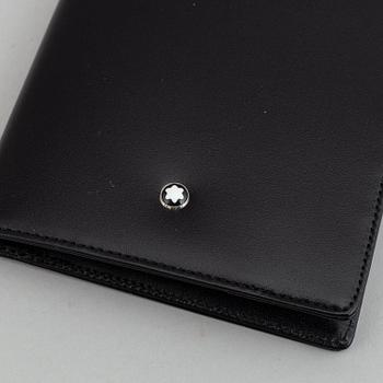 MOntblanc, a ball point pen and leather passport holder.