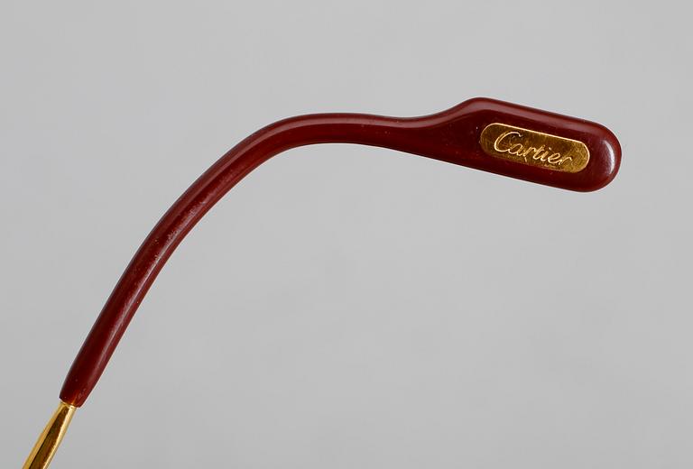 SOLGLASÖGON, Cartier.