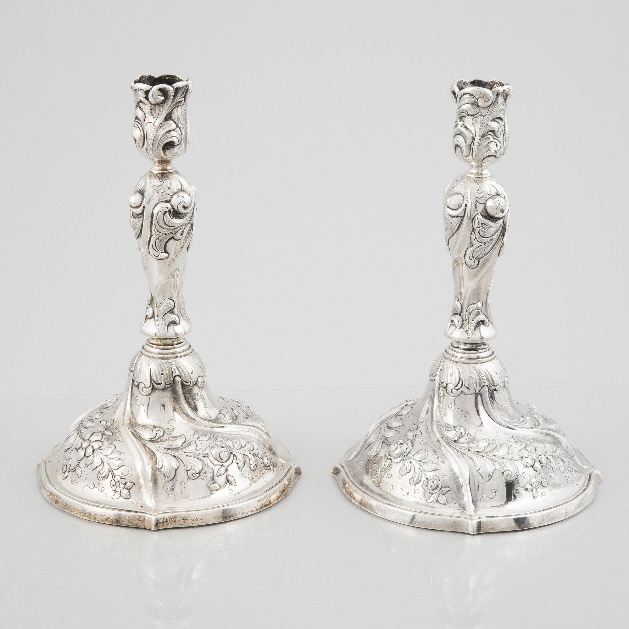 A pair of Rococo style sterling silver candelsticks, Swedish import mark.