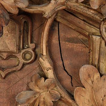 A Black Forest area pendulum wall clock.