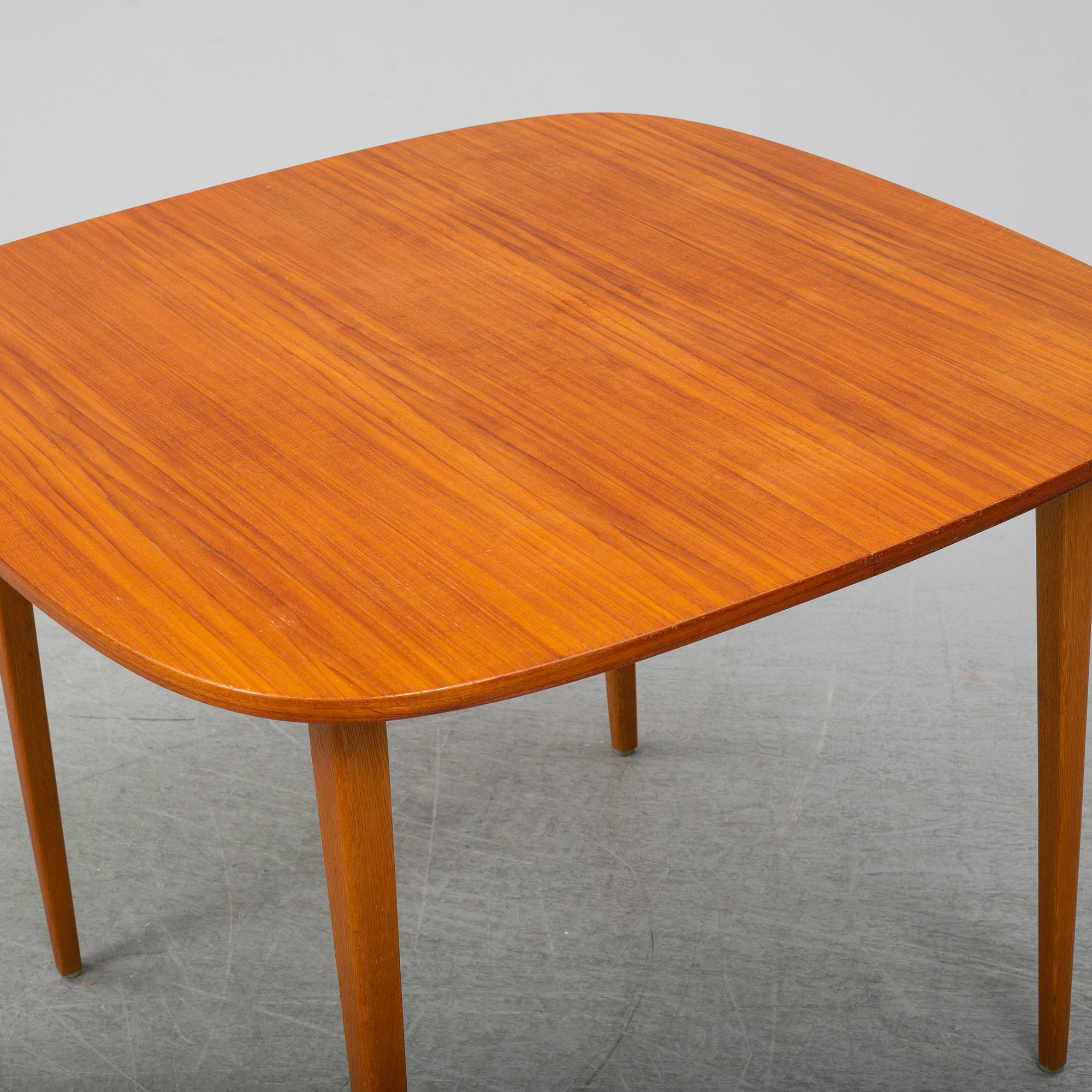 A second half of the 20th Century teak dining table.