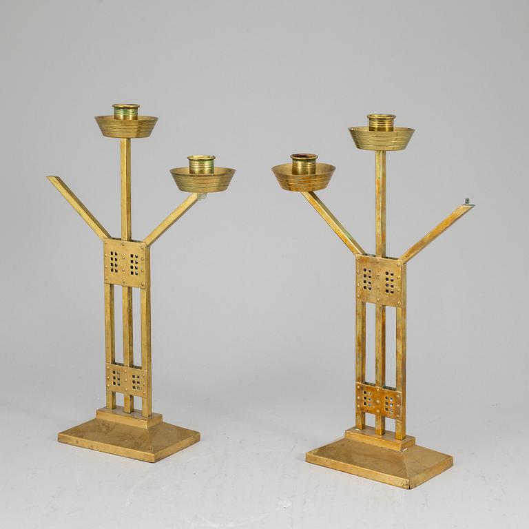 A pair of Art nouveau brass candelabra, early 20th Century.