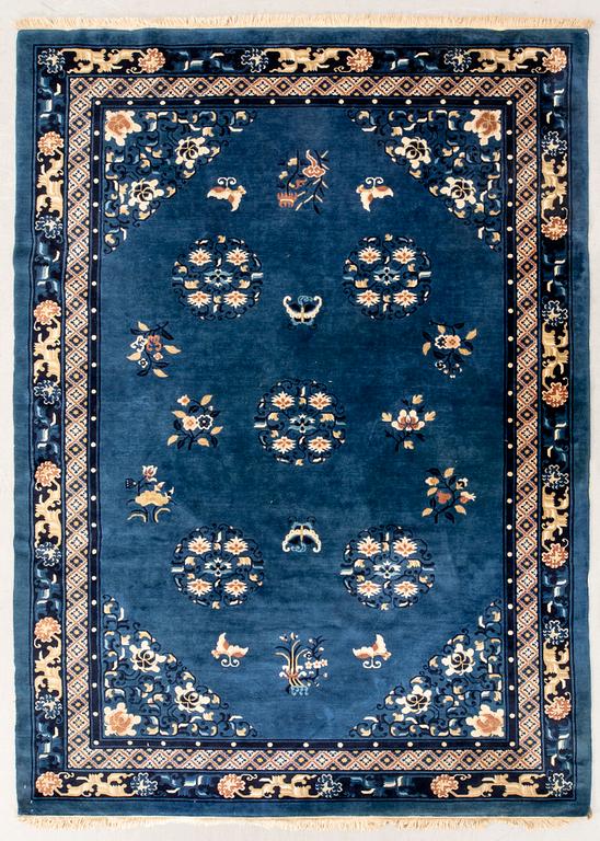 An old Chinese carpet ca 290x200 cm.