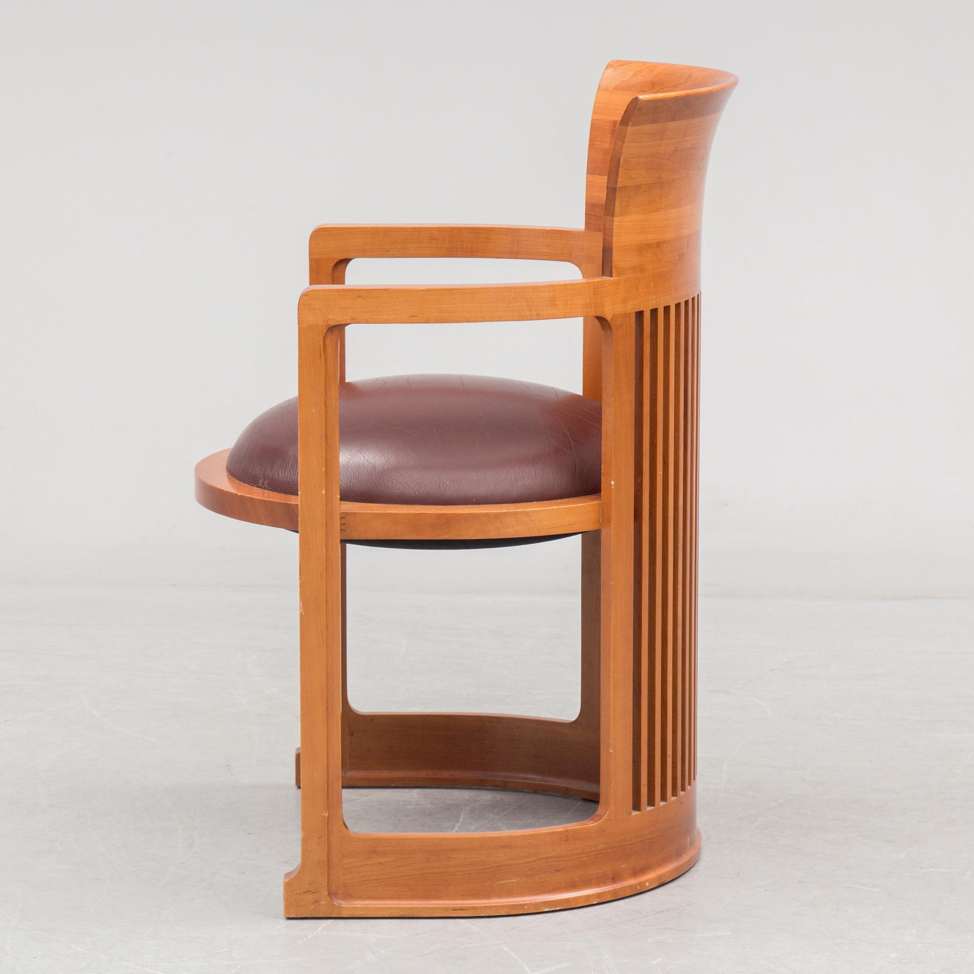 FRANK LLOYD WRIGHT, A cherry wood 'Barrel chair' from Cassina, late 20th century.