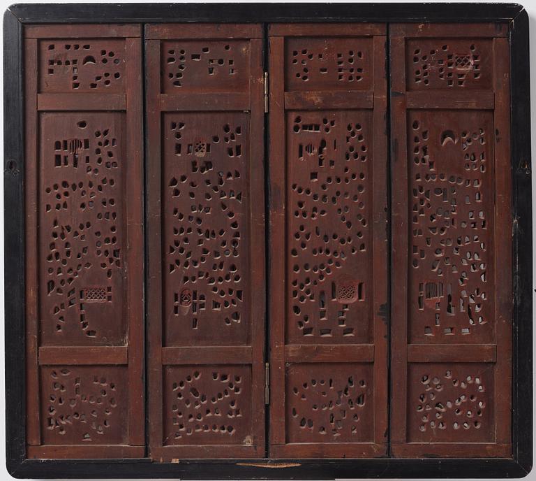 A set of four framed wooden panels, Qing dynasty, 19th Century.