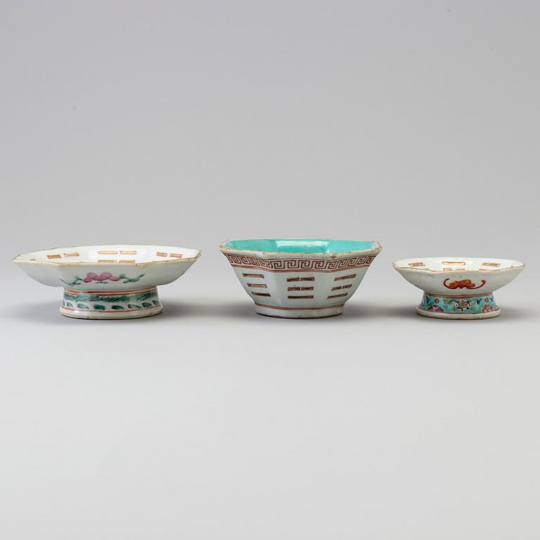 Two Chinese famille rose 'tri-gram' patterned footed dishes and one bowl, early 20th century.