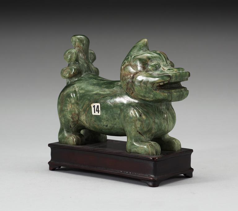 A nephrite figure of a Buddhist Lion, late Qing dynasty.