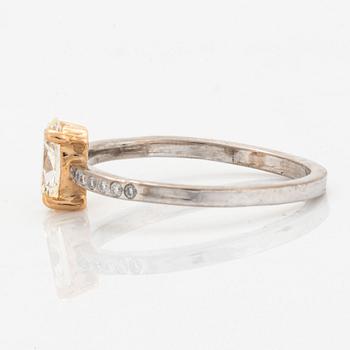 Oval diamond and brilliant-cut diamond ring.