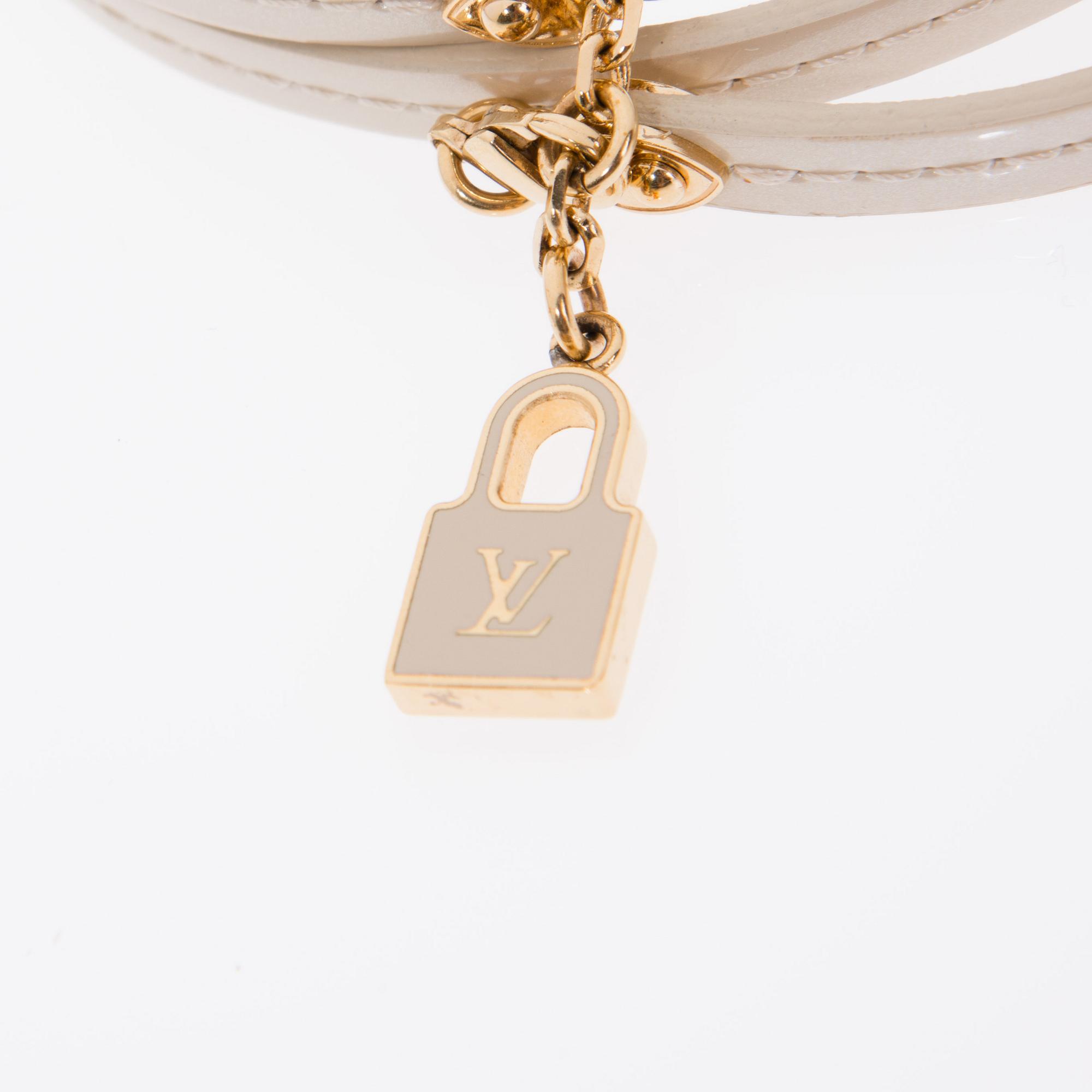 ARMBAND, "Commit", Louis Vuitton.