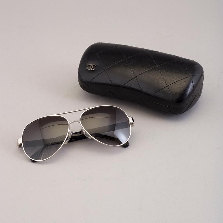 Chanel black pilot summer glasses.