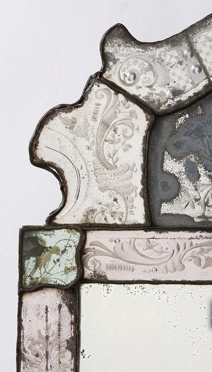A Northern European late baroque engraved glass mirror, first part 18th century.