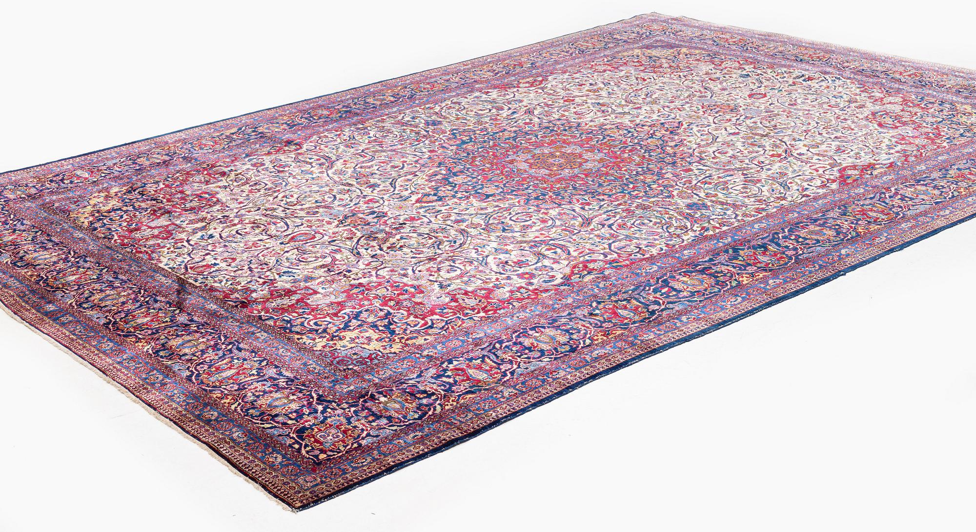 An antique silk Kashan carpet, central Persia (Iran) c. 378 x 259 cm.
