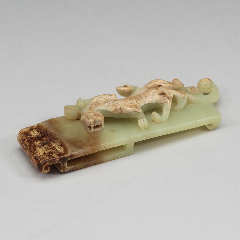 A nephrite scabbard slide, possibly late Warring States (475 B.C - 221 B.C).