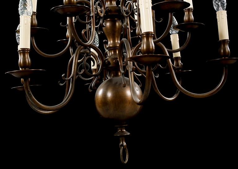 A patinated brass chandelier, first half of the 20th century. Height excl. chain ca 75 cm.