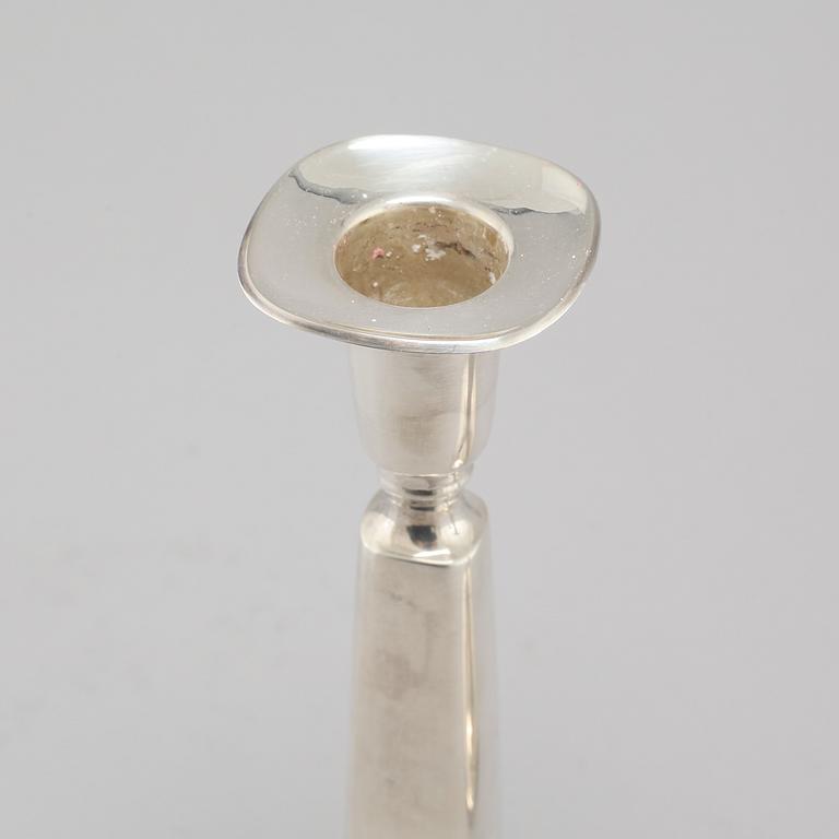 A pair of silver candlesticjs by Tore Eldh for K&EC in Gotheburg, 1970.