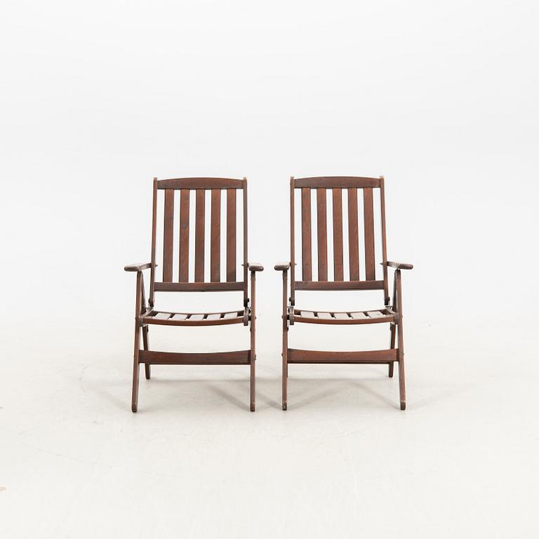 A set of five stained wood garden chairs from KWA around year 2000.