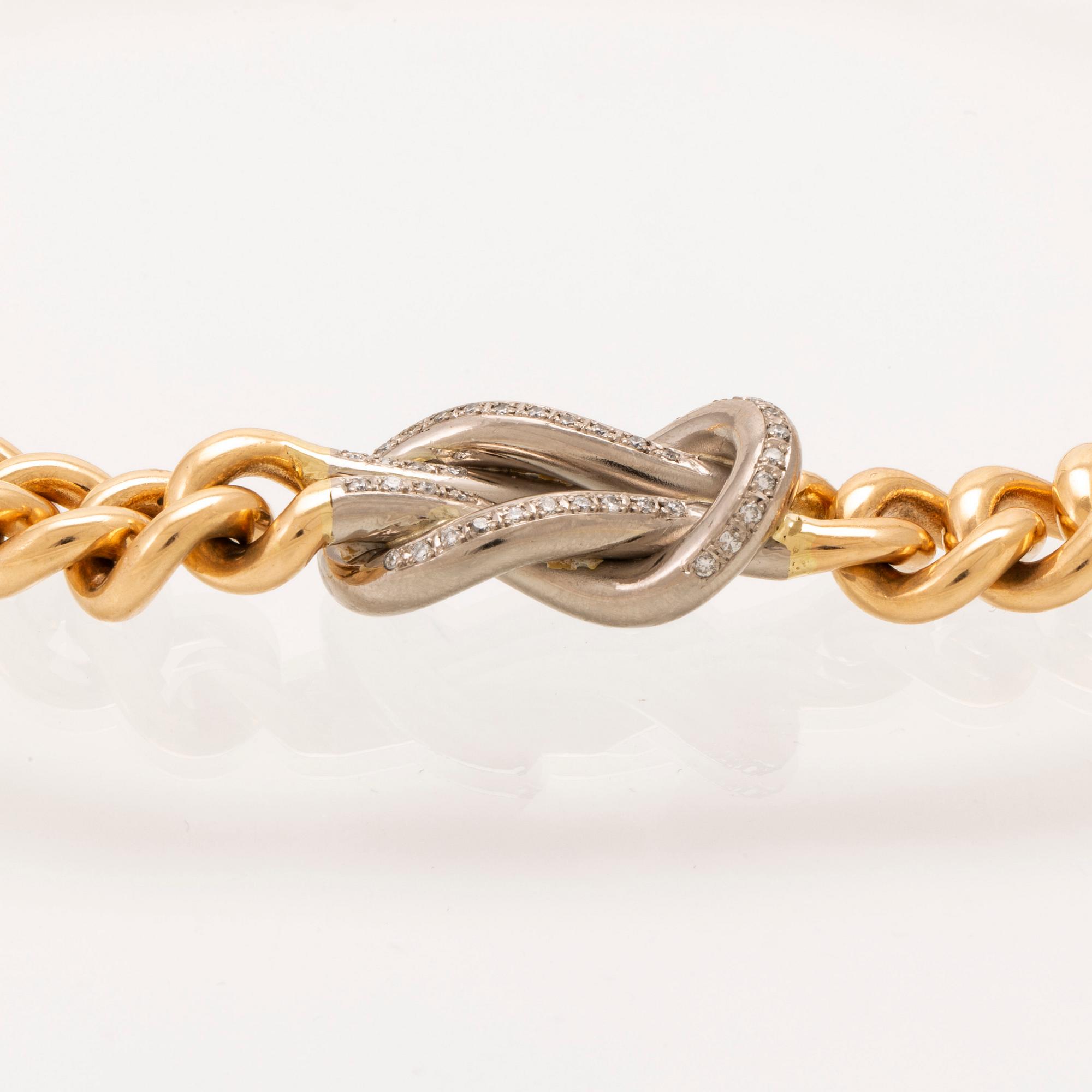 An 18K gold necklace weight 183,6 grams, 0,4 ct brilliants.