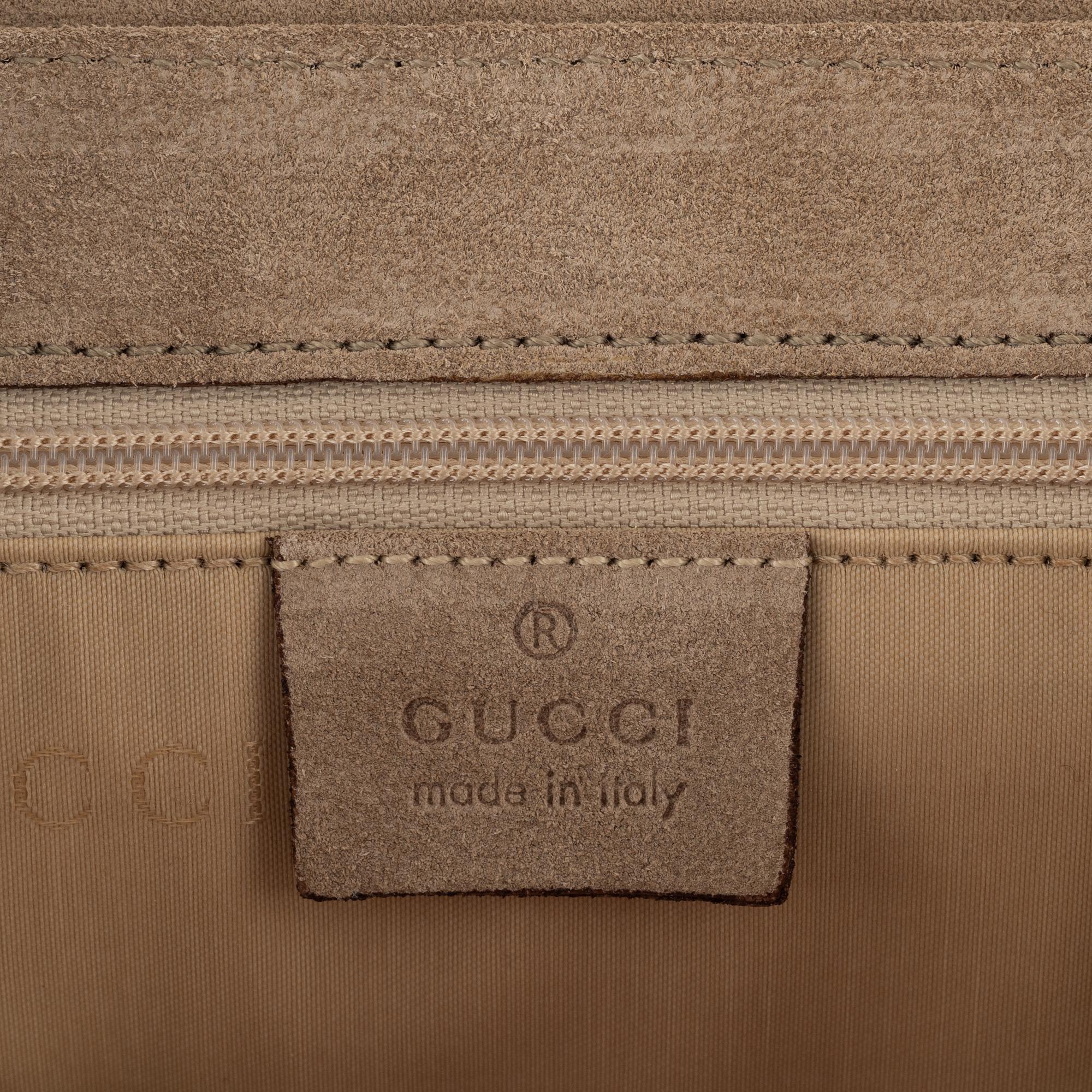 Gucci, a suede handbag.