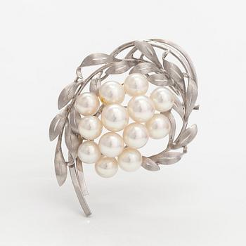 A 14K white gold brooch with cultured pearls.