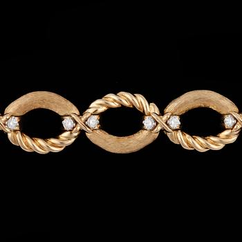 1053. A Tiffany gold and diamond bracelet, tot, app. 1.20 cts.
