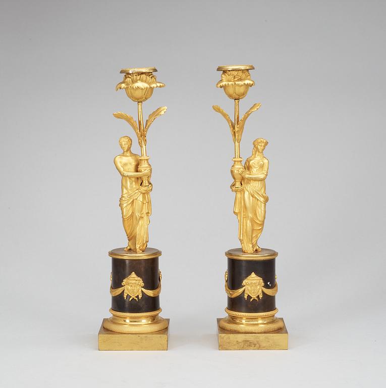 A pair of Louis XVI late 18th Century candlesticks.