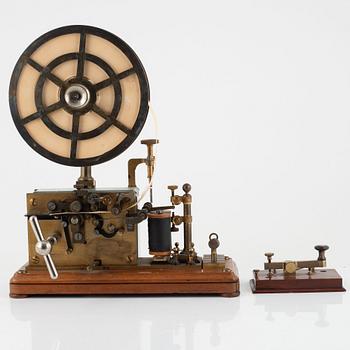 A telegraph from LM Ericsson, and a telegraph key from Digney Frères, early 20th century.