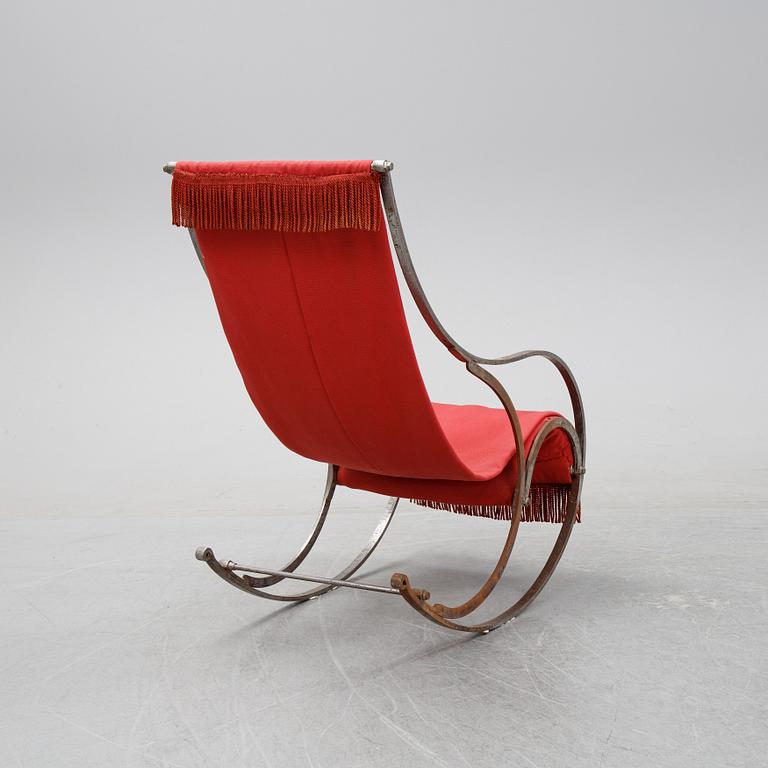 A 20th Century iron rocking chair.