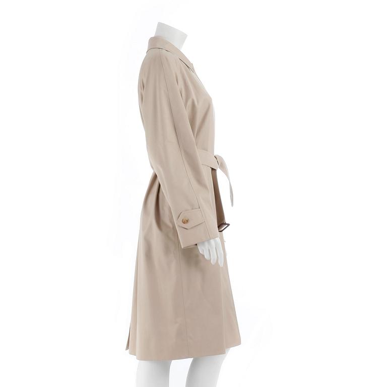BURBERRY, a beige cotton blend trench coat and a shawl.