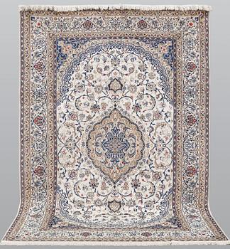 A carpet, Nain Part silk, 312 x 207 cm.