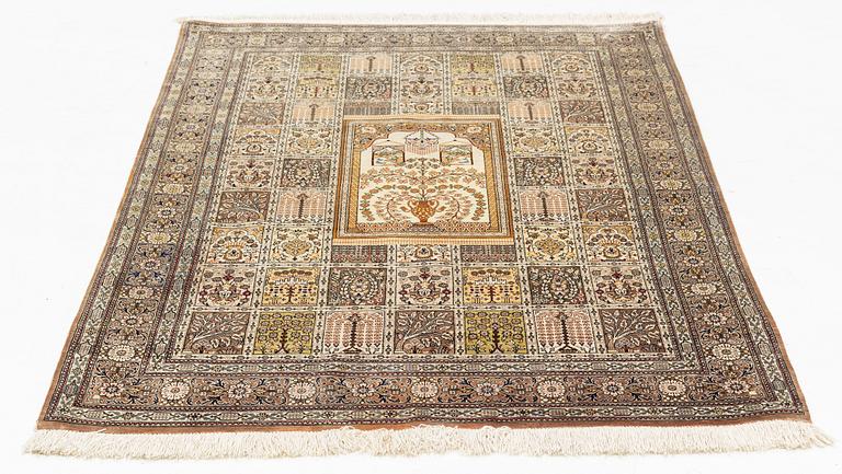 A carpet, oriental silk, circa 145 x 97 cm.