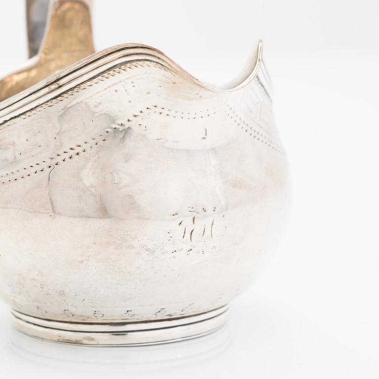 A Georgian sterling silver jug, late 18th century. Worn marks.