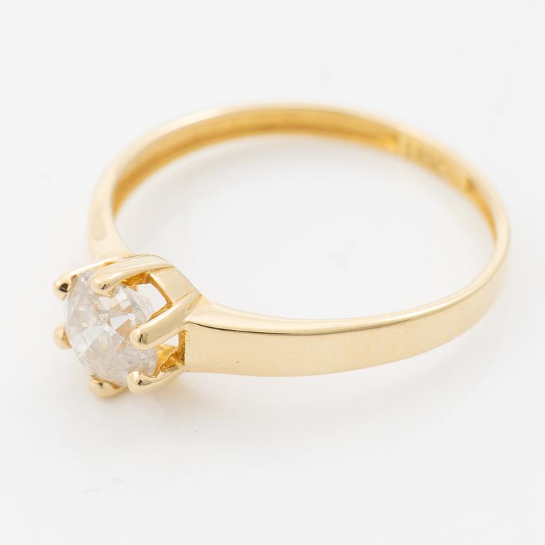 18K gold ring with an old-cut diamond.