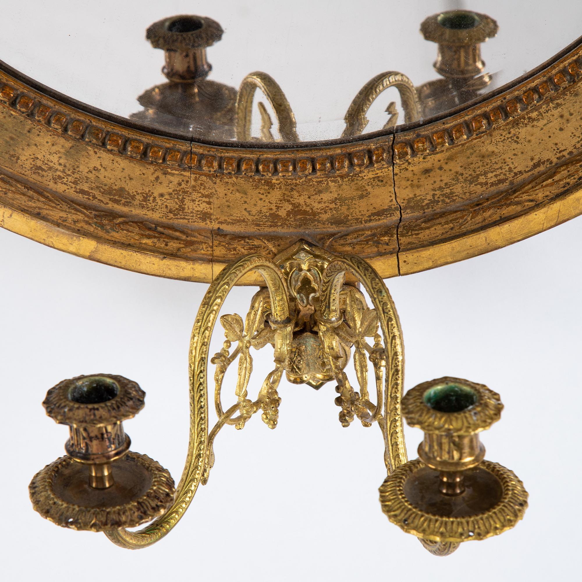 A Gustavian two-light girandole mirror, Stockholm, late 18th century.