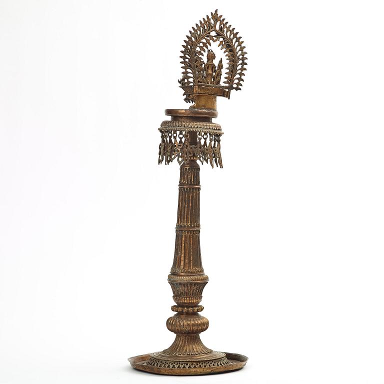 A copper alloy temple lamp, Nepal, circa 1900.