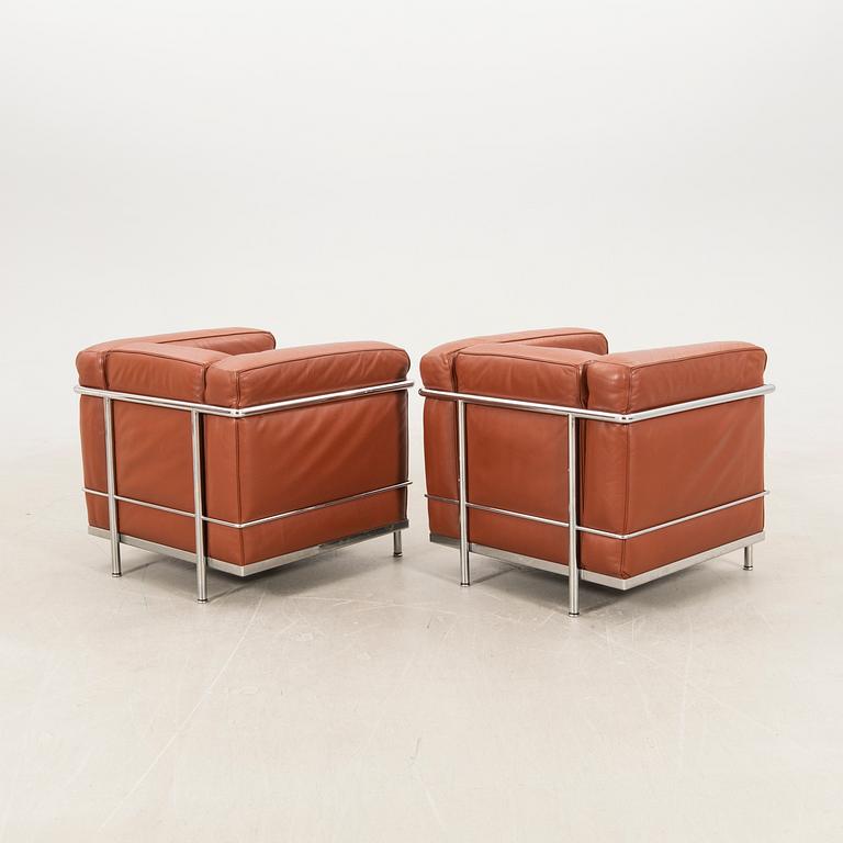 Le Corbusier, Pierre Jeanneret & Charlotte Perriand, a pair of armchairs, "LC2", Cassina, Italy, late 20th century.